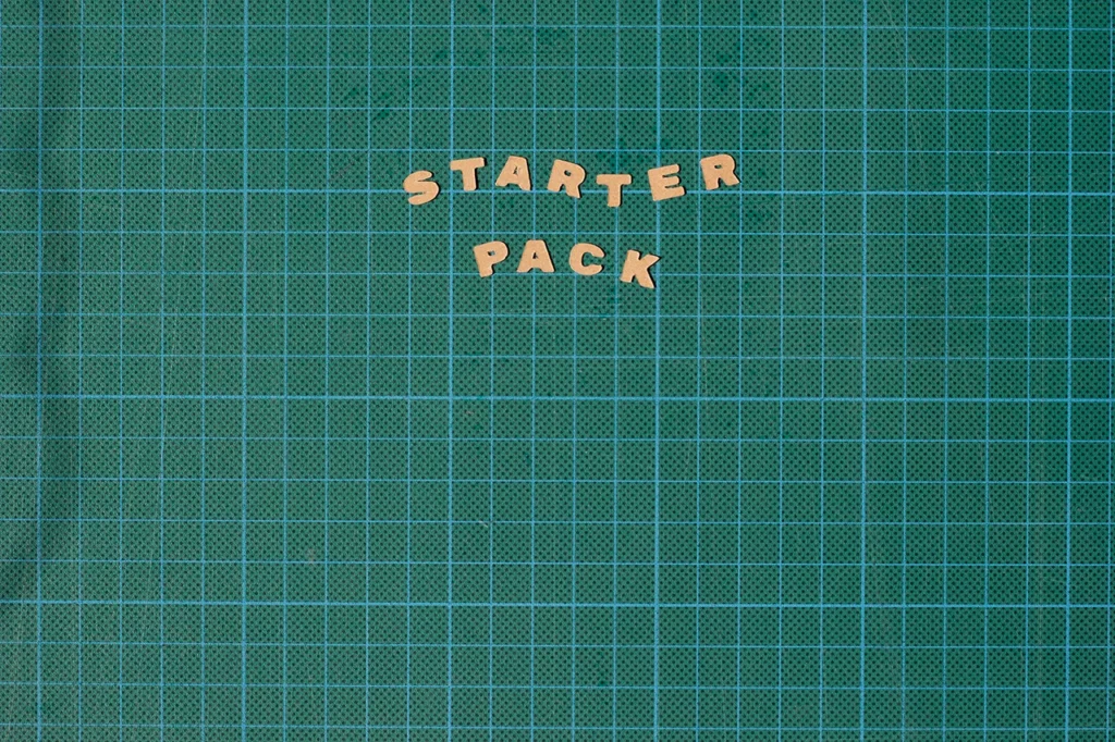 Lettrage "Starter Pack" découpé et placé sur mon tapis de découpe.